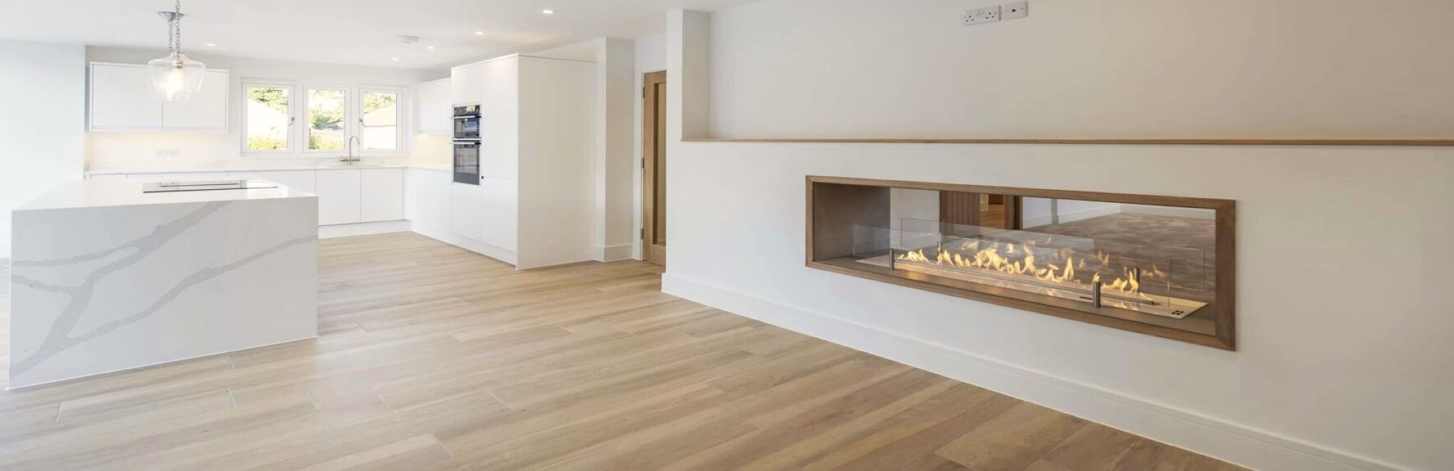 See-through fireplace with bioethanol insert in modern living room