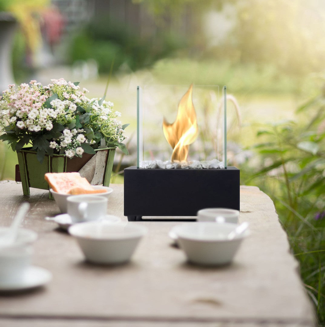 Black CUBE Bioethanol Burner Tabletop on garden table