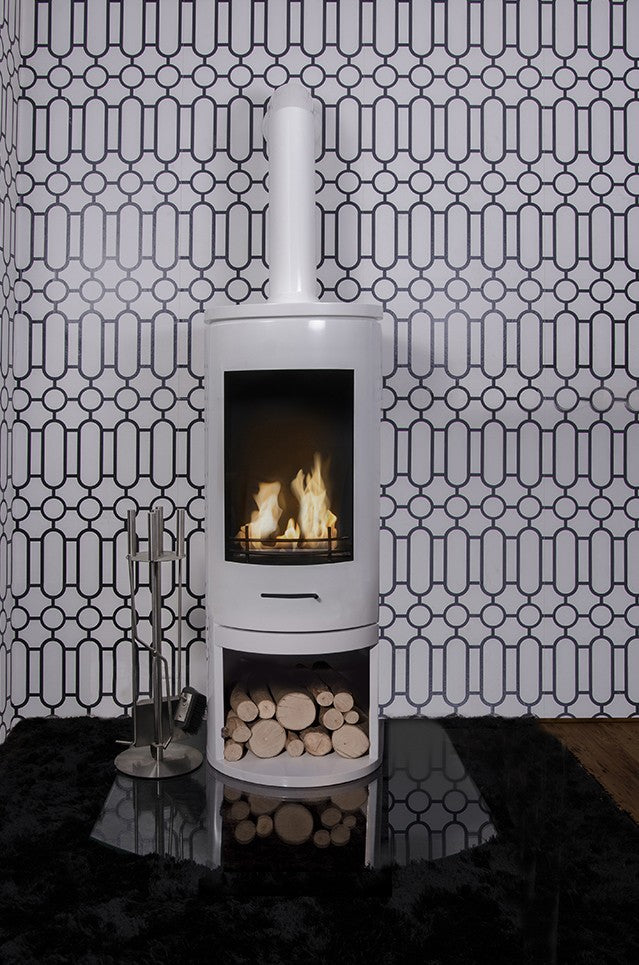 CYLINDER White Modern XL Bioethanol Stove  on display against  tile wall art