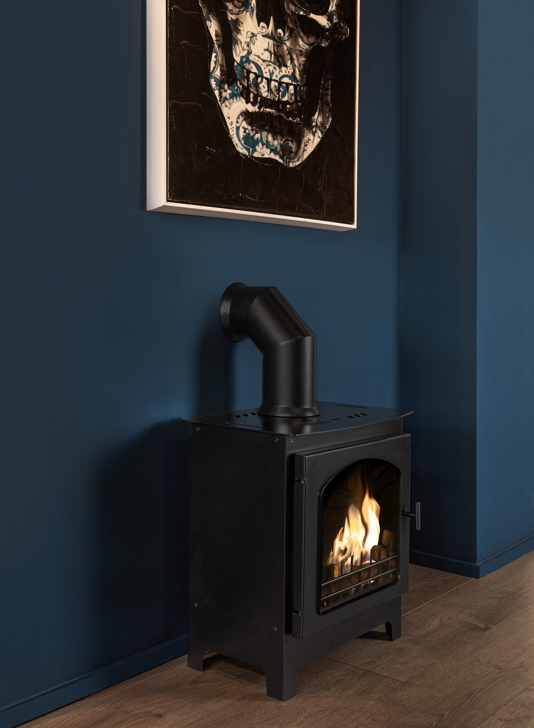 MULBERRY Black Bioethanol Stove against blue wall