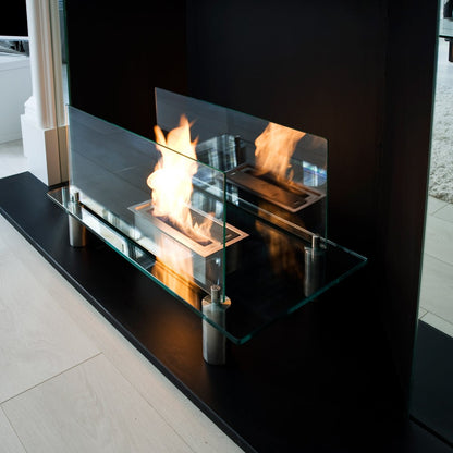 GRAVITY Bioethanol Glass Fire in modern fireplace opening angled view