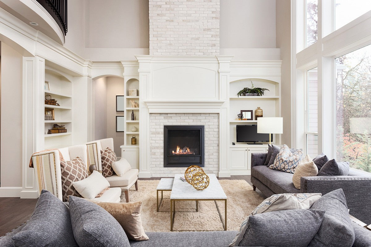 Planika L-FIRE  Fireplace in living room with white mantelpiece and brick wall