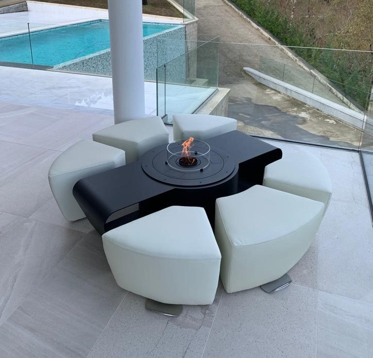 Circus with automated bioethanol burner and white ottomans