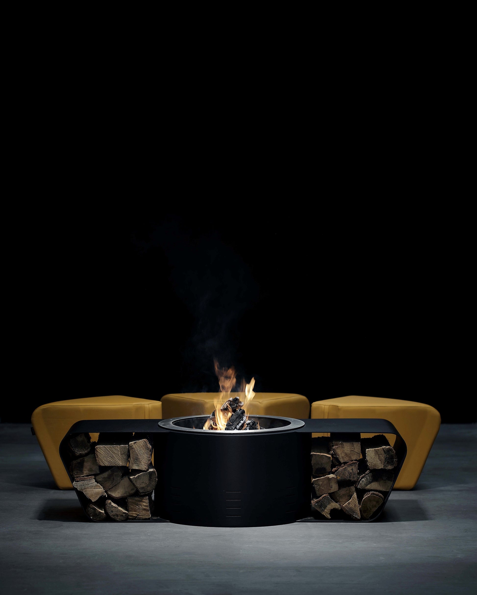 Circus with wood burner and saffron yellow ottomans. Display picture.