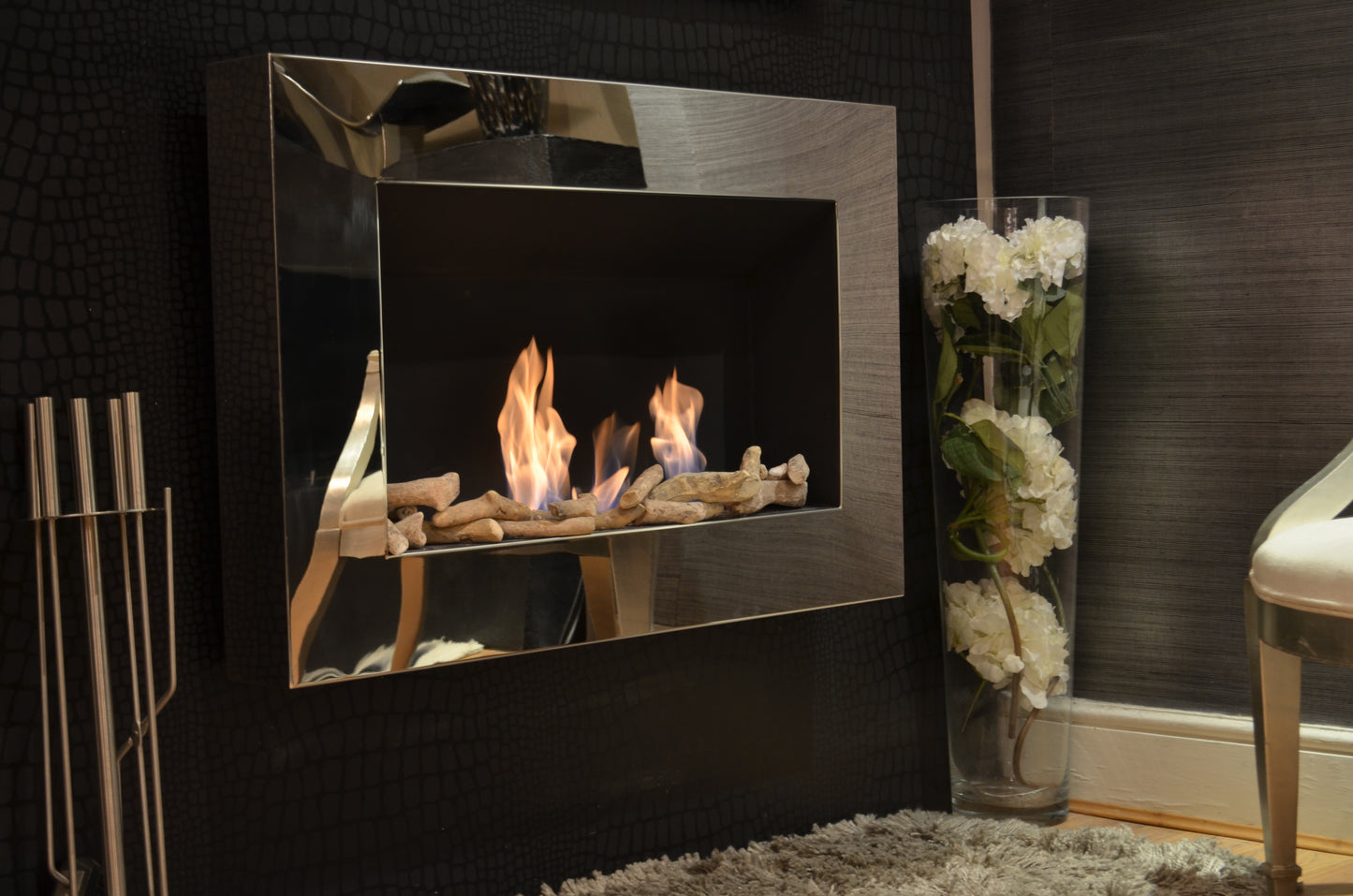 Phantom mirrored fireplace with drift wood