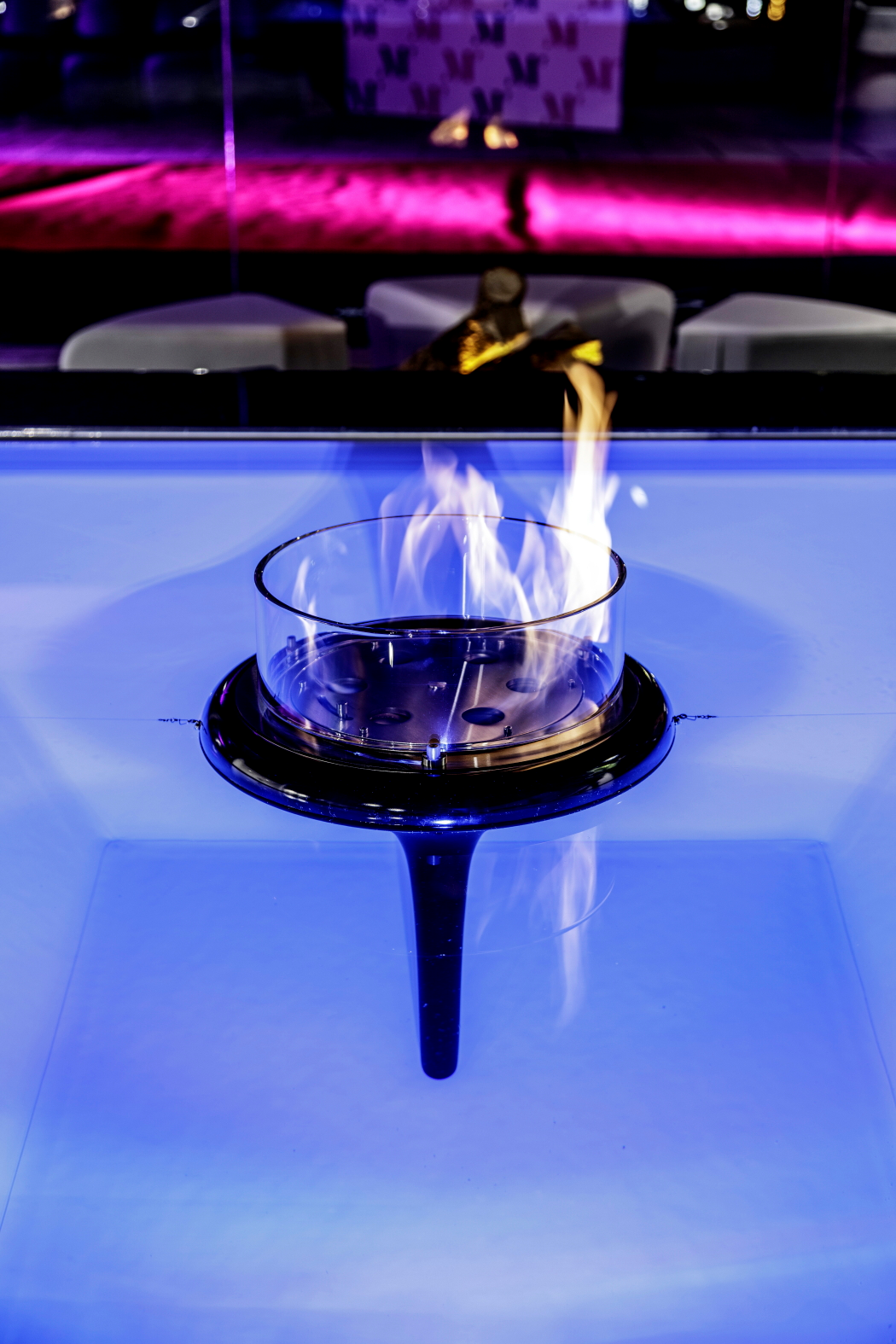 Black Flut in outdoor pool. Close up picture on fireplace and flame.