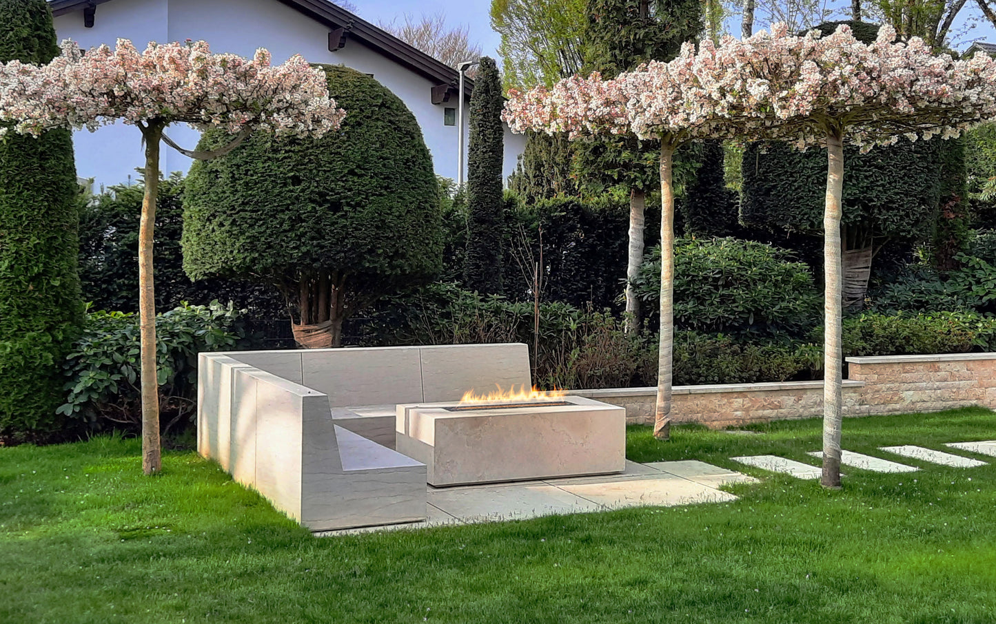 Galio Gas Insert in marble freestanding casing in outdoor patio with marble flooring