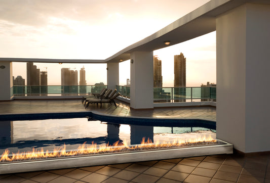 Outdoor fireplace. Bespoke size to run along the swimming pool edge.