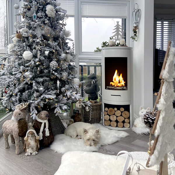 CYLINDER White Modern XL Bioethanol Stove with Christmas tree and decorations in living room